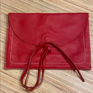 Boutique red pebbled clutch
